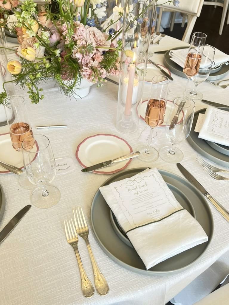 A bridal brunch table setting in grey and blush
