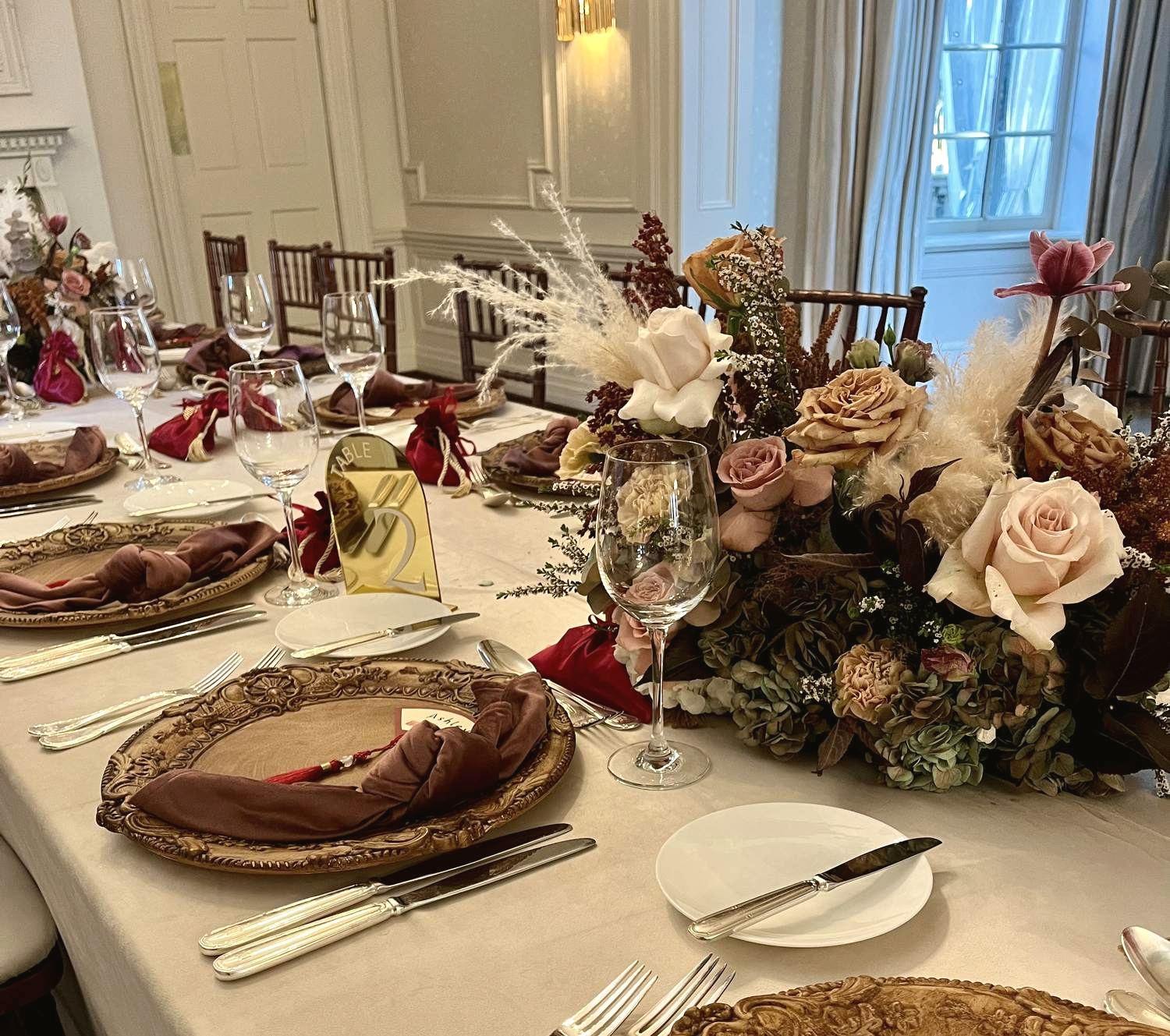 Table setting detail with vintage gold chargers